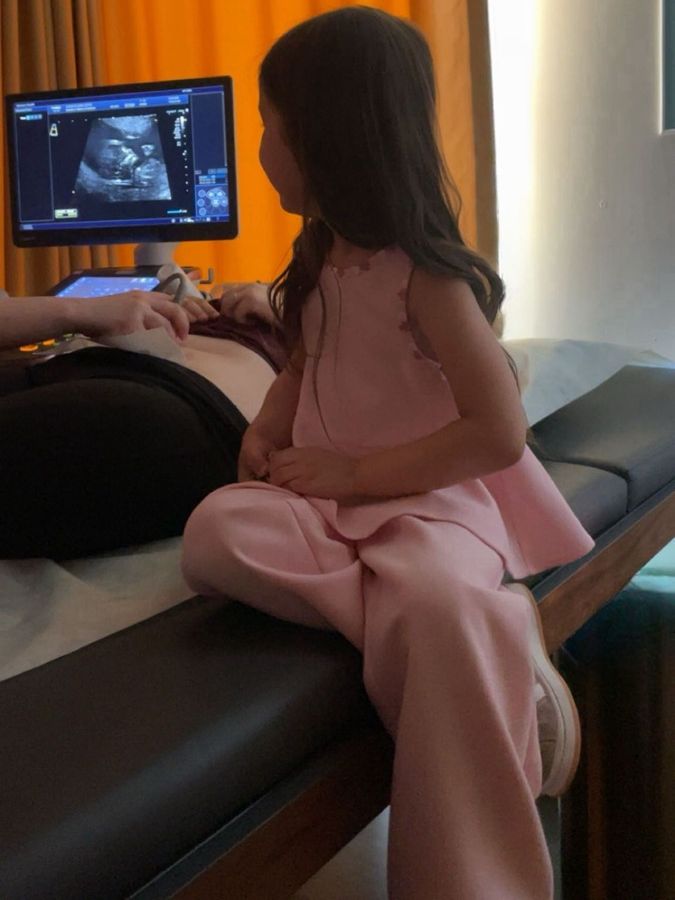Patient and screen during an ultrasound examination at the clinic